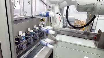 Robotic loading of bottles into the cartons