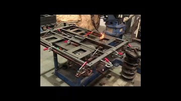 A video tells you how a robot arm in a custom display rack factory is welded