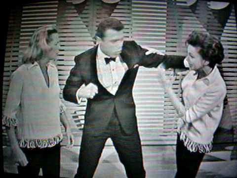 Steve Lawrence tries to deck Judy.