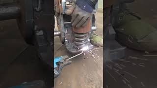 the stage of joining a spring to iron by welding it is done by experts#automobile