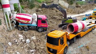 The cement silo was damaged by the storm, construction vehicles cement trucks helped to repair them