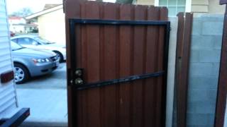 Redwood gate with square tube framing The strength of wrought iron with the look of wood.