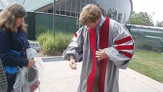 Eric putting on Phd  Gown MIT 2015