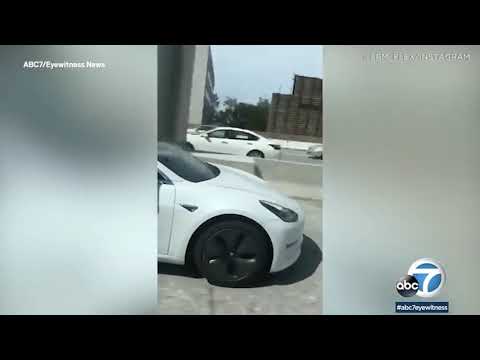 Tesla driver filmed 'fast asleep' while car barreled down freeway