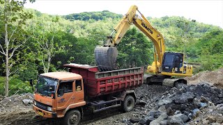 Excavator Trucks Digging New Road Through The Hills