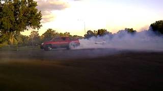 red 2003 avalanche doing donuts