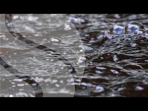 Slow Motion Tea-Colored Water with Bubbles for Quiet Focus