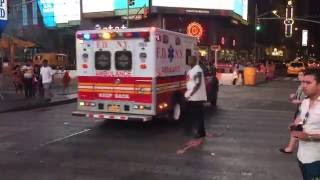 FDNY Ambulance Responding Through Heavy Traffic In Times Square