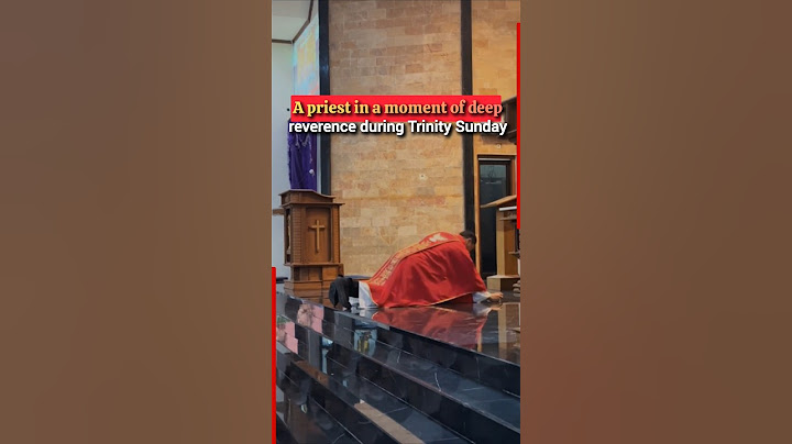 A priest lays prostrate in a moment of deep reverence on Trinity Sunday #priest #father #reverend