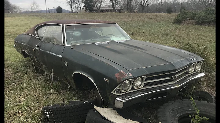 ABANDONED 1969 SS396 CHEVELLE PARKED BESIDE A HOUS...
