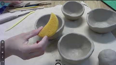 Attaching two pinch pots together and adding the head