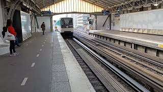 Paris Métro Line 6 train bound for Charles de Gaulle Étoile enters Bir-Hakeim Station