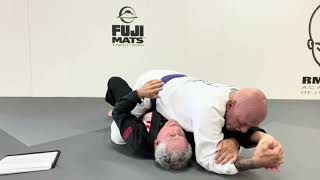 Age 66 year old BJJ brown belt candidate performing submissions from top position #2