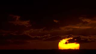 Sunset Whispers: Clouds Veiling the Sun in Twilight's Embrace 🌅☁️ #SunsetClouds #TwilightMagic