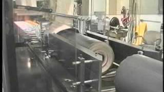 ARPAC's 125 FFS-50-28 Inline Shrink Bundler Bundling Roofing Rolls