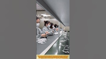 Earphone assembly: Skilled workers organize cables, test quality, and ensure perfect packaging