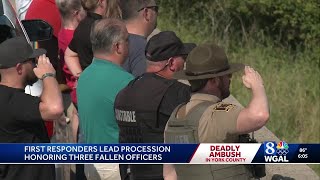 Growing memorial for fallen officers as community pays respects