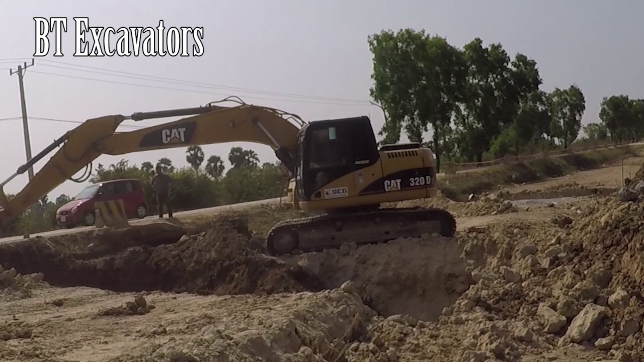Construction Excavator Loading Rock, Excavator Working On Road, Cat ...