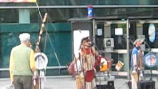 man dances with native american performers