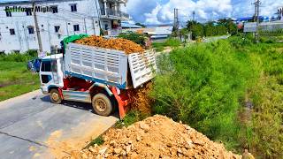 Land filling process for old projects, Bulldozer KOMATSU D31P, Dump Truck unloading