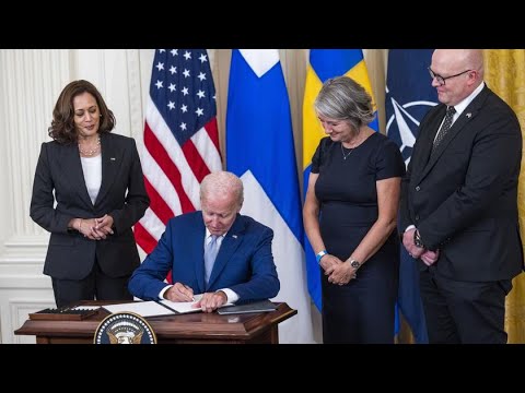 President Joe Biden signs documents of U.S. support for Sweden and ...