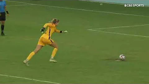 Goalkeeper Katie Lund makes, saves a penalty kick ...