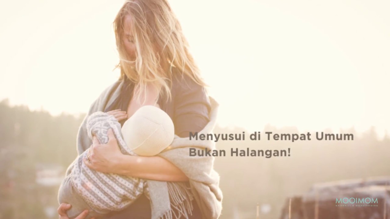Menyusui. Кормление грудью. Фотосессия с новорожденным на улице. Красивое кормление грудью. Женщина кормит ребенка.