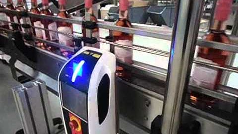 iCON Laser Codes Wine Bottles on Single Line Conveyor