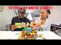 AMERICANS TRY JAPANESE SNACK BOX | Bronson and Jas Japanese Candy Taste Test
