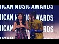 The Singing Voices Of HUNTR X Accept The Award For Song Of The Year 52nd American Music Awards 