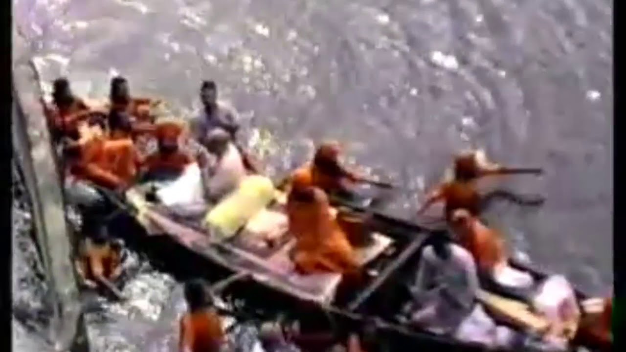 Baba Shrii Shrii Anandamurti Crossing through flooded From Tiljala  to lake garden