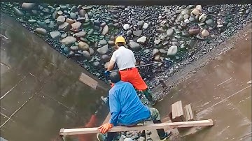 Barge unloads 3400 tons of large cobblestone in beautiful sunny weather - Relaxing video