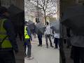“Manchester protest turns bizarre… umbrellas used as shields 😳”