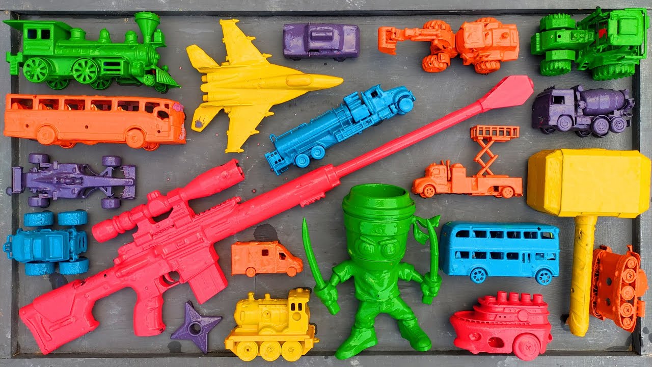 cleaning toy racing cars, trains, cement mixer trucks, ambulances, double-decker buses, excavators