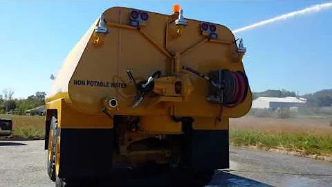 New CAT 745C 9,000 gallon water truck with front spray bar by HEC(3)