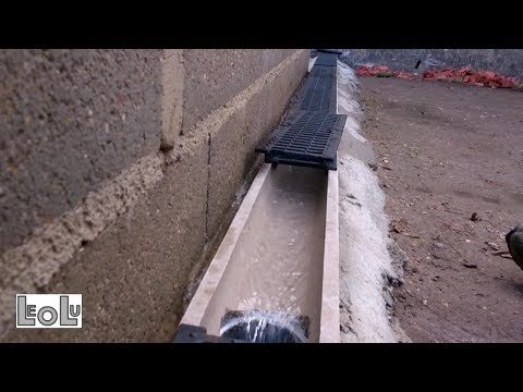 Pose de caniveaux en béton polymère