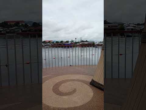 one of the local tourist attractions a floating restaurant towed along the river kwai