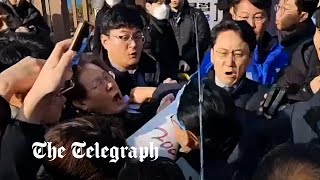 video: South Korea’s opposition leader stabbed in neck by man posing as autograph-hunter
