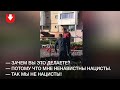 В Уручье местные мешают неизвестному мужчине срезать белые и красные ленты 20 сентября