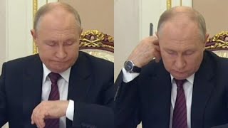 На что смотрел Путин - на часы или бумаги?