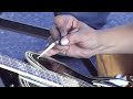Hiro "Wildman" Ishii pinstriping a guitar at the MoonEyes Car Show, 12/09/2006