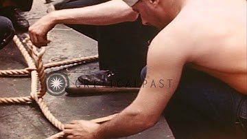 Men make cargo nets from 2" manila rope aboard USS Olympus (AGC-8) in the Atlanti...HD Stock Footage
