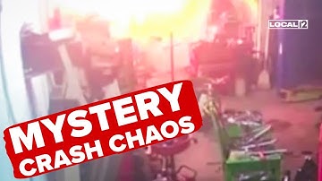 VIDEO: Unidentified object crashes into auto shop, causing bright flash and damage