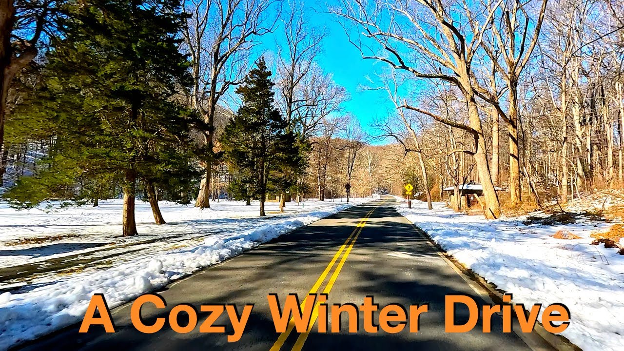 A Cozy Winter Drive: Scenic Snowfall and Tranquil Views