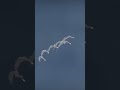 Multiple Missiles Strike Group Flying Over Aircraft Carrier