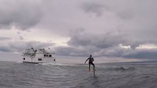 Michigan man surfs on Great Lakes behind Beaver Island ferry