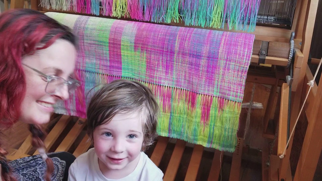 Cutting a baby wrap off the loom