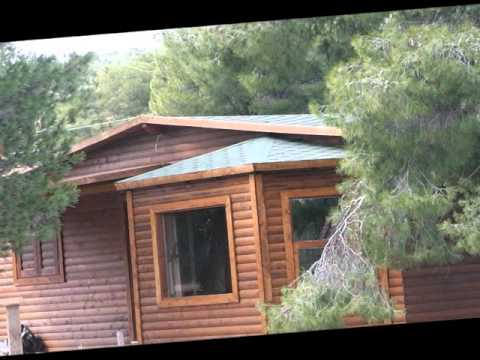 Βίντεο: Κληματαριές από ένα κούτσουρο (87 φωτογραφίες): μοντέλα από ένα στρογγυλεμένο κούτσουρο και ένα ξύλινο σπίτι, ψιλοκομμένες επιλογές κορμών για να δώσετε με μπάρμπεκιου