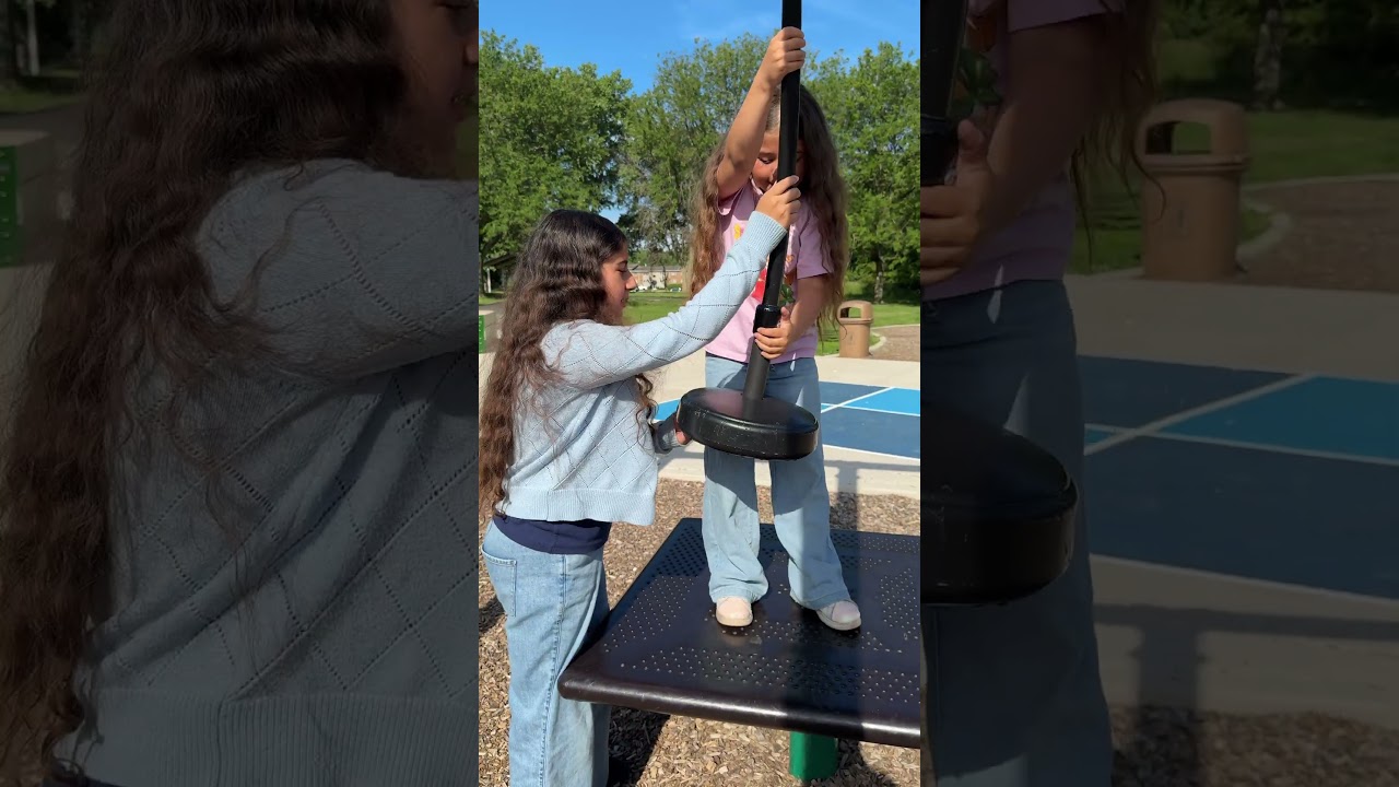 Big Sister Helps Little Sister At The Playground