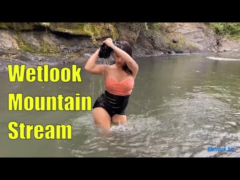 Wetlook girl get wet in mountain stream in skirt and tights | Wetlook fishnet tights